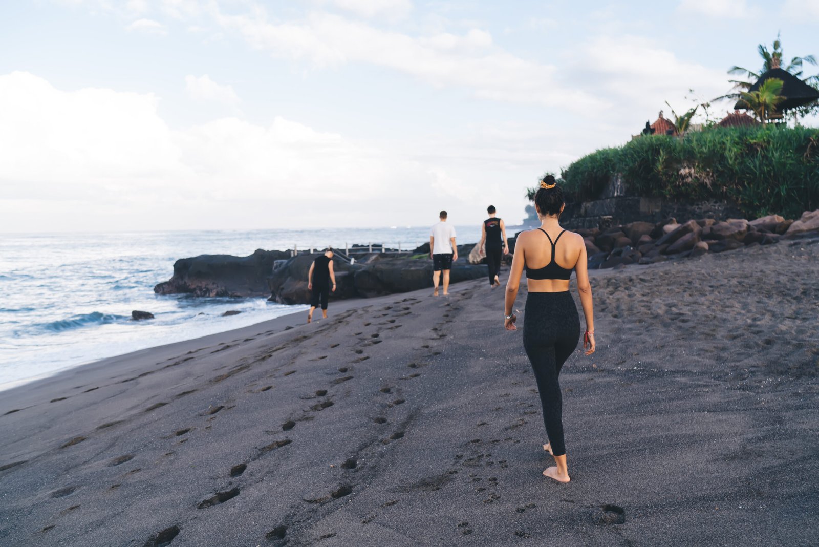 unrecognizable-tourists-walking-at-coastline-seash-2023-11-27-05-33-18-utc